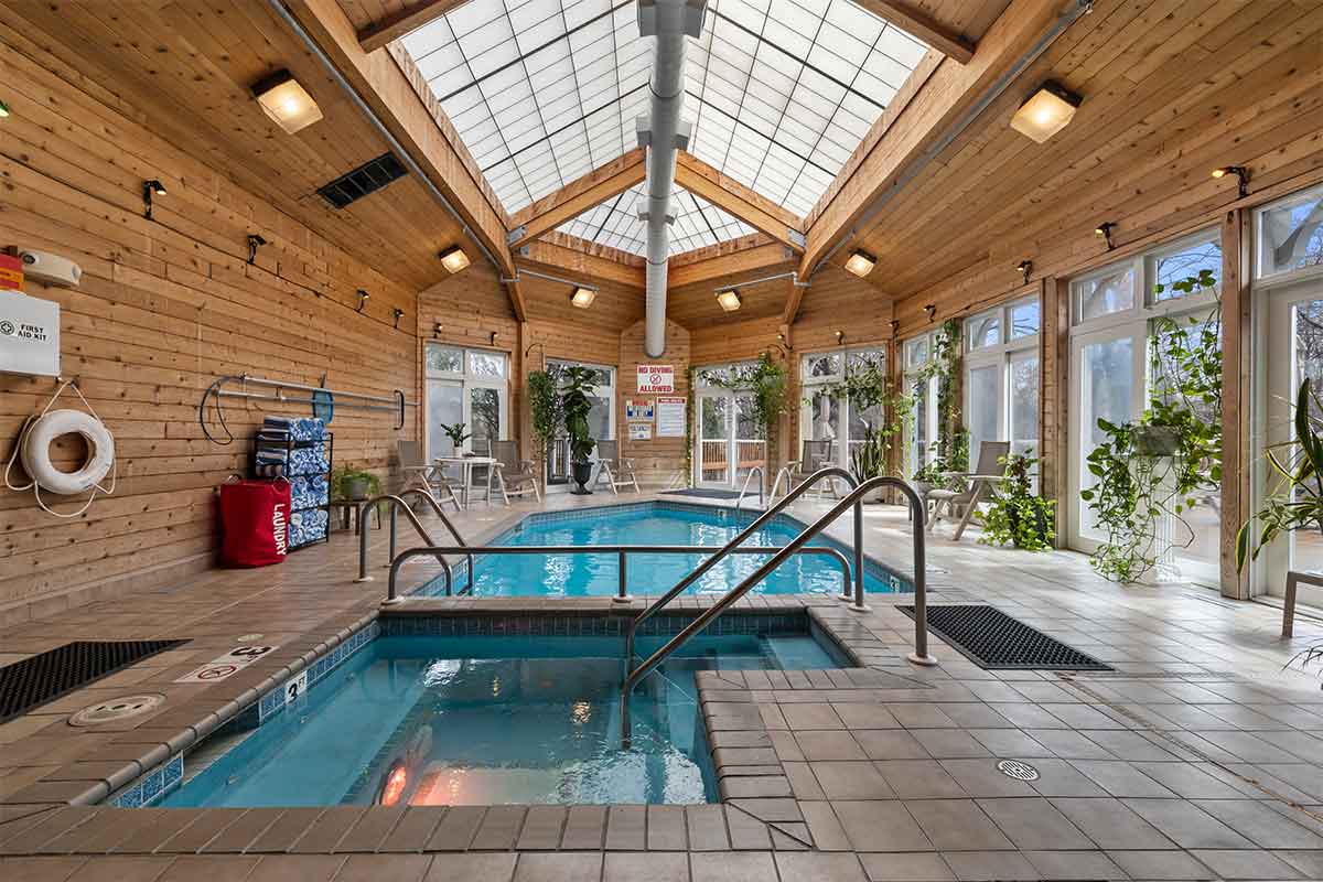 Amenities at The Mill Creek Hotel and Suites in Lake Geneva Wisconsin include a indoor solarium with pool and whirlpool hot tub