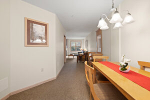 Gold Suite Plus dining area with table seating at The Mill Creek Hotel and Suites in Lake Geneva