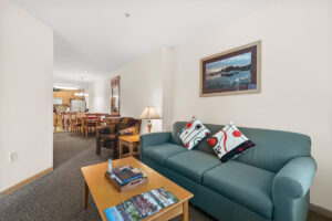 Gold suite plus living area with TV, fire place, kitchen and sleeper sofa at The Mill Creek Hotel and Suites in Lake Geneva