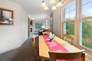 Platinum suite dining area with table seating at The Mill Creek Hotel and Suites in Lake Geneva