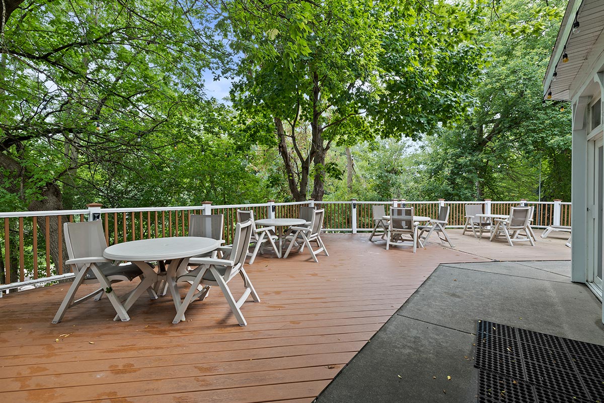 Amenities and attractions at The Mill Creek Hotel and Suites in Lake Geneva Wisconsin include an outdoor deck overlooking downtown and the White River